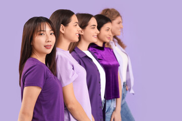 Group of young women on lilac background