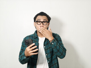 Asian man looking to camera with shock expression isolated on white background