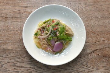 glass noodles with Vietnamese sausage and chop pork spicy salad on plate  