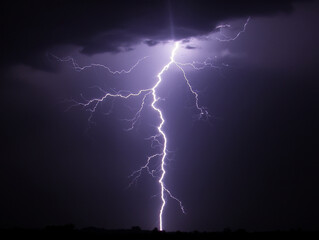 Night sky illuminated by a dramatic lightning bolt -ai