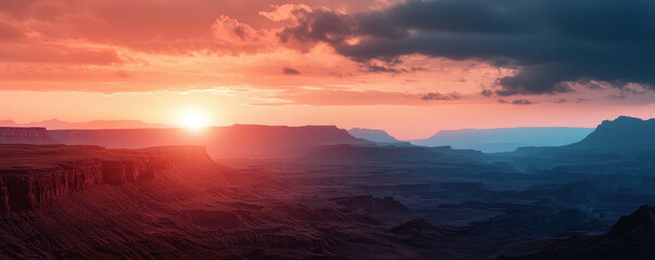 Vast canyon landscape under breathtaking sunset sky
