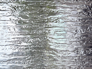Close up of textured rain glass pattern. 3D textured glass in rain pattern. Seamless background texture