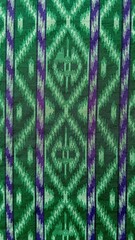 Obraz premium Traditional fabric pattern. traditional Indonesian woven fabric. Sarong. Green pattern