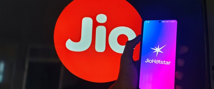 New Delhi, India - February 15 2025. Jio hotstar app icon on mobile screen, a person using Jiostar after merge of Jiocinema and Hotstar. 