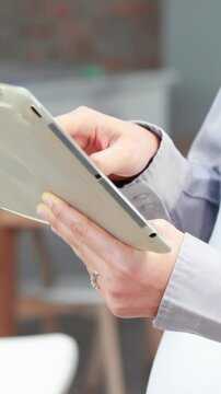 Pregnant asian woman using tablet pc