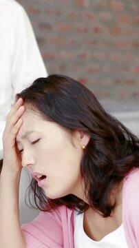 Pregnant asian couple planning together