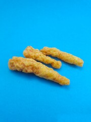 Crunchy salty snack on a blue background