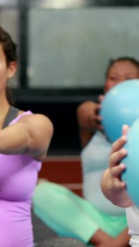 Pregnant women in fitness studio