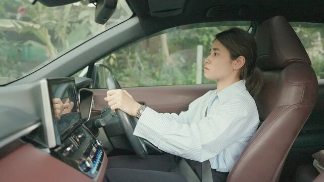 Business woman driver honking a car during driving on traffic road, hand controlling steering wheel in vehicle. Journey, trip and safety Transportation concepts