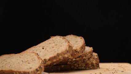 Slicing fresh whole grain bread kitchen counter food warm ambiance close-up view freshness and nutrition concept