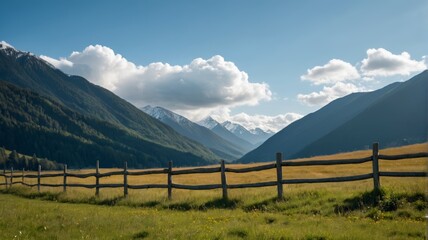 Fototapeta premium mountains in the distance with a wooden fence in the foreground
