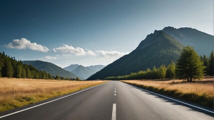 Naklejka premium there is a long road going through a field with mountains in the background