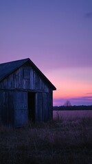 Obraz premium Rustic Barn at Sunset with Vibrant Skies and Peaceful Landscape