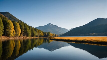 Fototapeta premium mountains are reflected in the water of a lake surrounded by trees