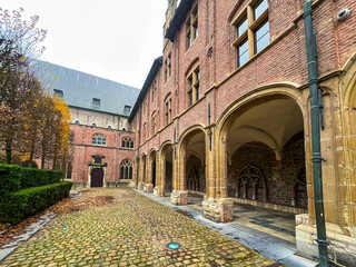 Beautiful arches and columns in historic courtyard of ghent university, belgium