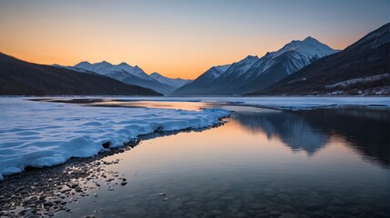 Fototapeta premium mountains are reflected in the water of a river at sunset