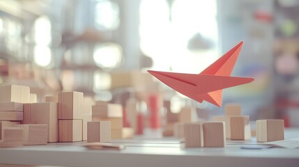 Conceptual Image of Paper Airplane Flying Above Wooden Blocks