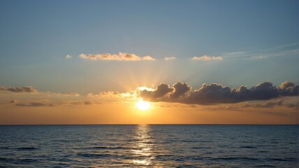 arafed view of a sunset over the ocean with a boat in the water