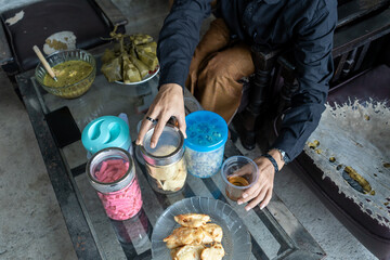 Ramadan Hari Raya high angle indonesian family having family reunion dinner assorted indonesian food at home celebrating ramadan