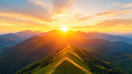 Stunning Aerial View of Expansive Mountain Scenery at Sunrise with Vibrant Sky and Sun Rays