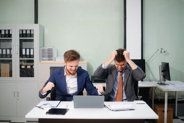 A stressed business team in shock after financial failure. Upset colleagues brainstorm solutions,...