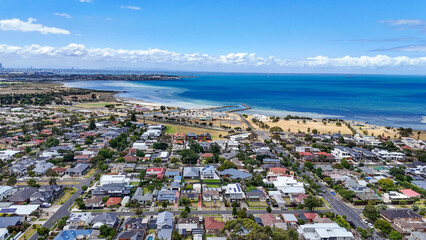 Aerial view of Seaholme, a bayside suburb of Melbourne Australia, featuring a beach, suburban...