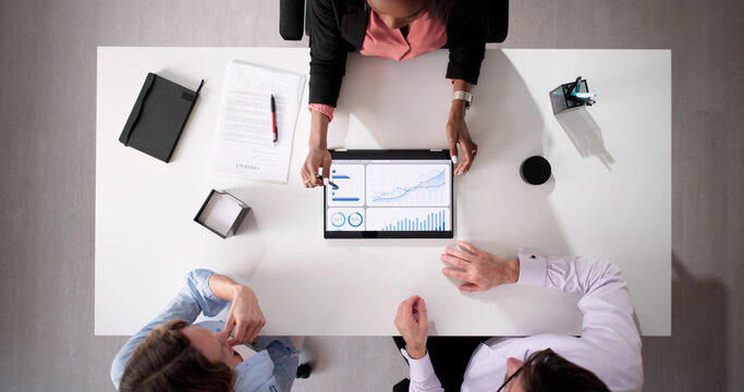 Financial planner offering investment advice to young couple