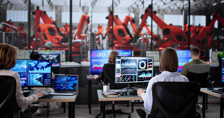 Diverse Group of Technicians Monitoring Scada System