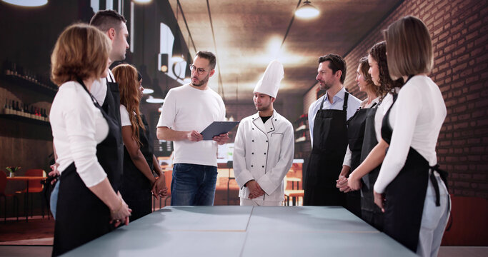 Collaborative Multiracial Restaurant Staff Meeting, Asian Waiter