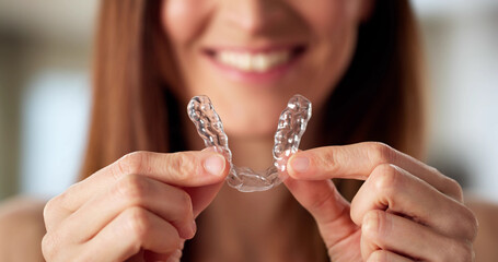 Dentist fitting clear aligner dental night guard