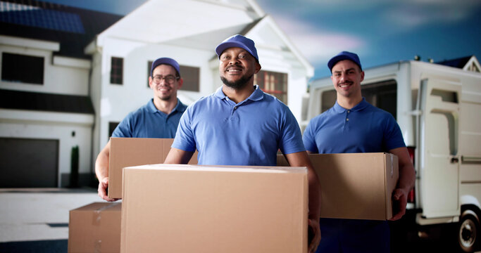Diverse group of movers smiling in front
