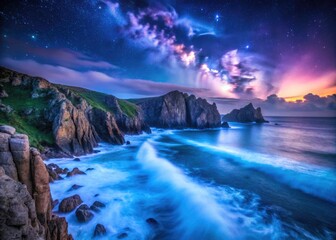 Naklejka premium Cornwall's Porthcurno coastline explodes with dramatic, low-light seascape magic at night.