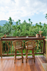 Relaxing balcony view overlooking lush tropical scenery in Bali or Thailand