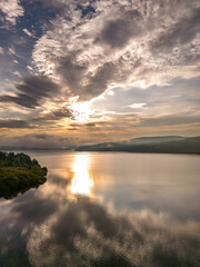 Naklejka premium sunset over the river