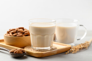 Almond milk in cup glass on white background, Alternative milk made from plant, non dairy