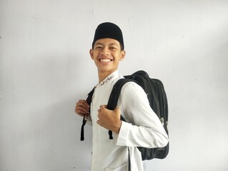 Asian Muslim man holding a black bag 