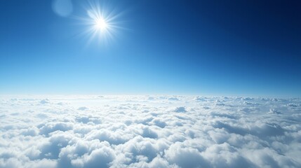 Spectacular bird’s-eye view captures a blanket of clouds beneath a serene blue sky.
