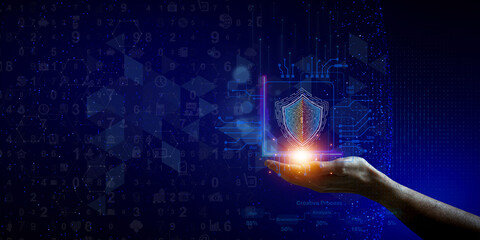 Data Security in the Palm of Your Hand: A glowing digital shield emerges from a hand, symbolizing the power and protection of cybersecurity in a dynamic, abstract visualization.