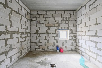 rough repairs for self-finishing. interior decoration, bare walls of the room, stage of...