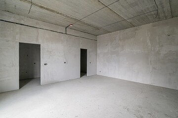 rough repairs for self-finishing. interior decoration, bare walls of the room, stage of...