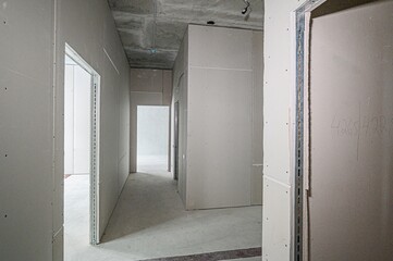 rough repairs for self-finishing. interior decoration, bare walls of the room, stage of construction. interior apartment room