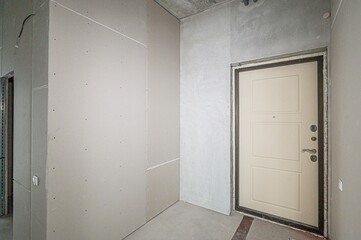 rough repairs for self-finishing. interior decoration, bare walls of the room, stage of construction. interior apartment room