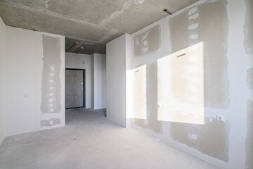 rough repairs for self-finishing. interior decoration, bare walls of the room, stage of construction. interior apartment room