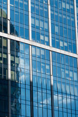 Obraz premium Skyscraper windows close-up. Window frames of demo-scrapers.