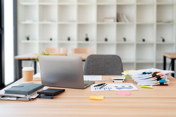Rear view of Laptop computer on table in bright room of home office workspace