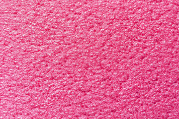 Ribbed pink surface of a camping mat as texture, background