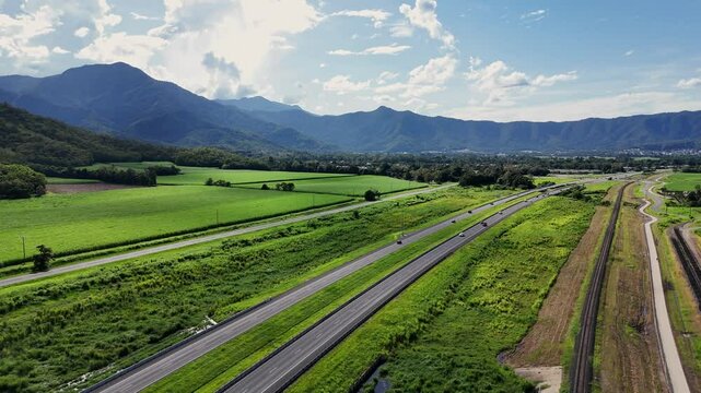 Bruce Highway in Cairns with tropical mountains in background