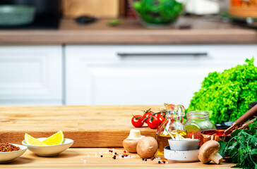 Healthy eating, cooking, food blogging background. Empty oak cutting board with tomatoes, lettuce, vegetables, olive oil on cozy kitchen with wooden table, kitchenware and ingredients