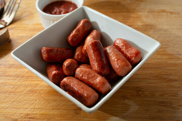 A view of a bowl of cocktail smokies.