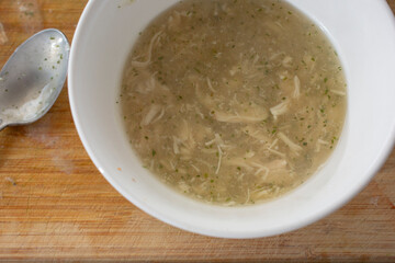 A top down view of a bowl of chicken gravy.